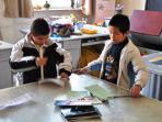 Volunteer with blind children in China