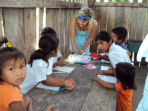 Volunteer with children in Ecuador