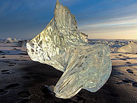 Sea washed ice sculpture on black sand