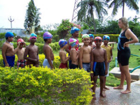 Teach children swimming in India