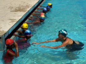 Teach children swimming in India