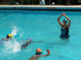 Teach children swimming in India