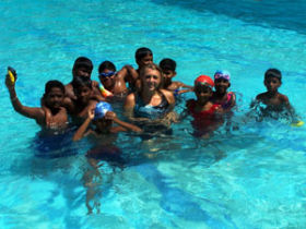 Teach children swimming in India