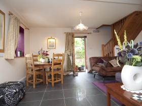 Chess Cottage taken from Kitchen across Dining area to Garden Door