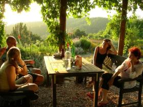 Relaxing under the pergola at Can Torras