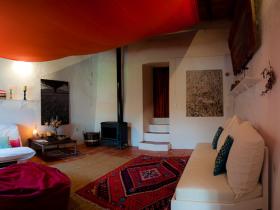 Living-room at Sobreira Cottage, with many refurbished things, including the heavy old cottage door.