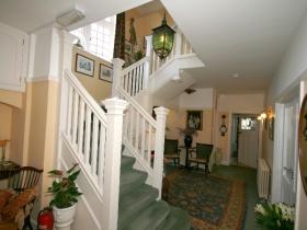 The elegant staircase leading to the first floor at Harvest House