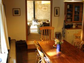 A well-equipped kitchen with an enormous farmhouse table.