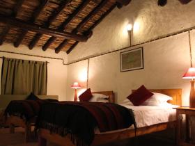 Twin bed room on the estate constructed using local Kumaoni architecture techniques