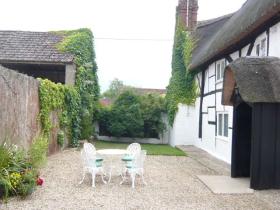 Secure back garden/yard area of Little Thatch (great for dogs)