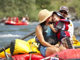 Family time while rafting on the Rogue River, Oregon, USA