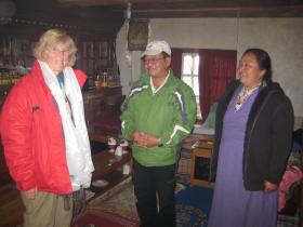 Julie arrives with her hosts, the Lama family