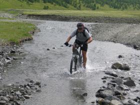 Cyclist crossing river