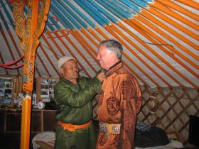 Motorcyclist wears traditional Mongolian dress