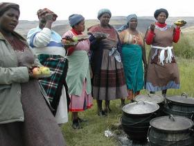 Women from the community preparing dinner