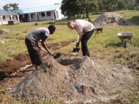 Mixing cement African style!