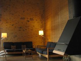 Lounge area with bamboo wall and wood burner