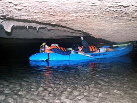 Inside a low cave in Halong Bay