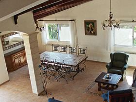 Upper dining room, containing a large wrought iron custom made dining table with its mosaics top