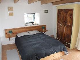 Double bedroom with patio doors to front