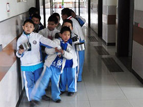 Volunteer with blind children in China