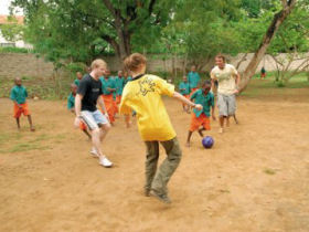 Volunteer with children in Mombasa, Kenya
