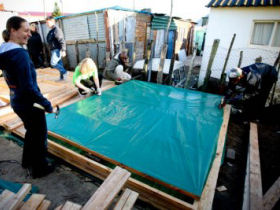 Volunteer with children in a township near Cape Town, South Africa