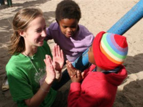 Volunteer with children in a township near Cape Town, South Africa
