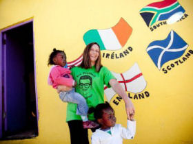 Volunteer with children in a township near Cape Town, South Africa