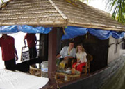 Relaxing on board Backwaters house boat accommodation in Kerala