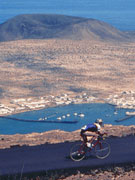 Cycling in Lanzarote with La Graciosa views. Photo by Lanzarote Tourist Board