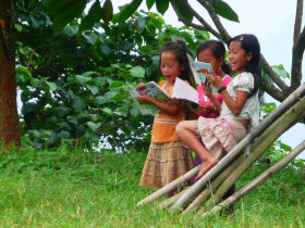 Volunteer with children in Laos