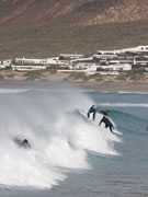 Surfers in Famara, Lanzarote. Photo by Nick Haslam