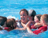 Swimming at family water sports centre in Greece