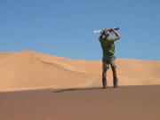 Dune sledding on Africa overland adventure holiday