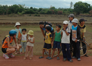 Mountain biking in Vietnam, Central Coast - interaction with local children