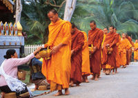 Monks collecting Alms on Laos holiday