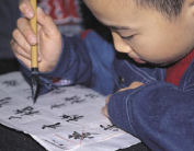 Learning calligraphy with local children, China family tours