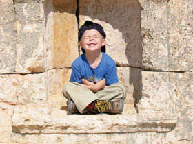 Child with Jordan ruins