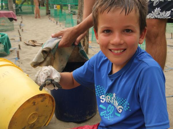 Family volunteering with turtles in Costa Rica