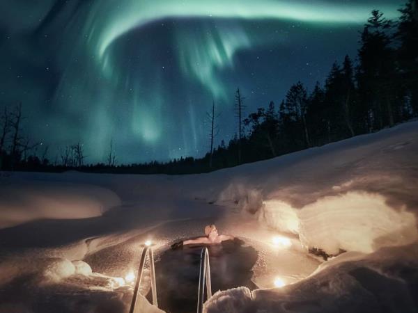 Northern Lights with snow hotel holiday