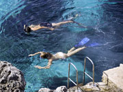 Snorkelling amongst the rocks in Menorca. Photo by Menorca Tourist Board