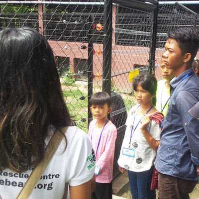 Youths listening to talk about bears