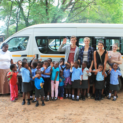 Group infront of minibus