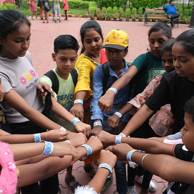 Group of kids fistbump at Nicco Amusement Park, India
